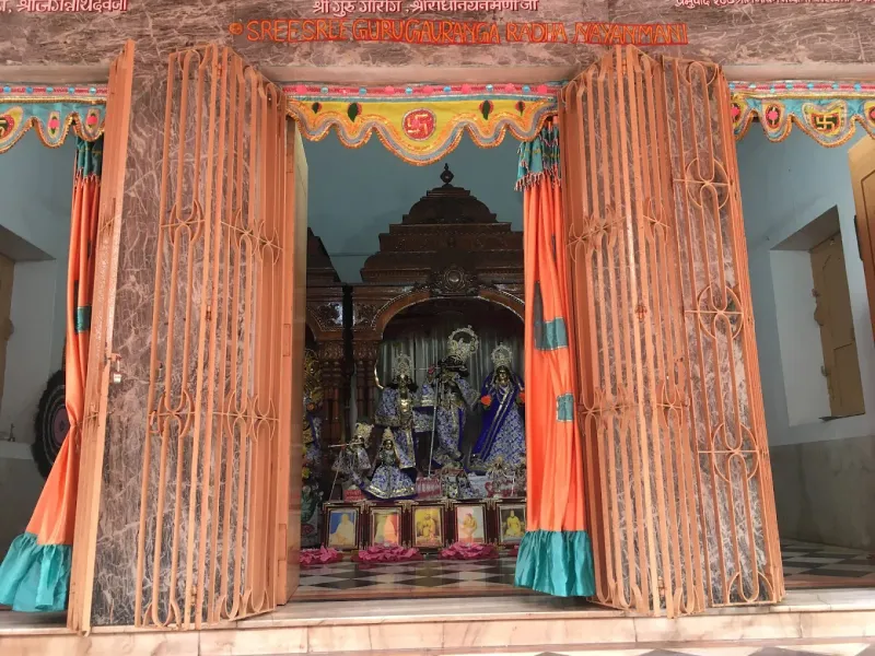 The shrine with its curtains drawn back for darshan — Shree Chaitanya Gaudiya Math, Puri
