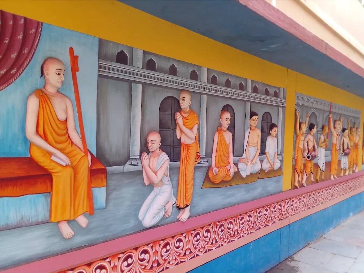 A painted corridor showing scenes from the lives of the acharyas — Shree Chaitanya Gaudiya Math, Puri