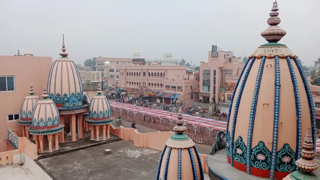 The domes of the Math rising over the rooftops of Puri towards the sea